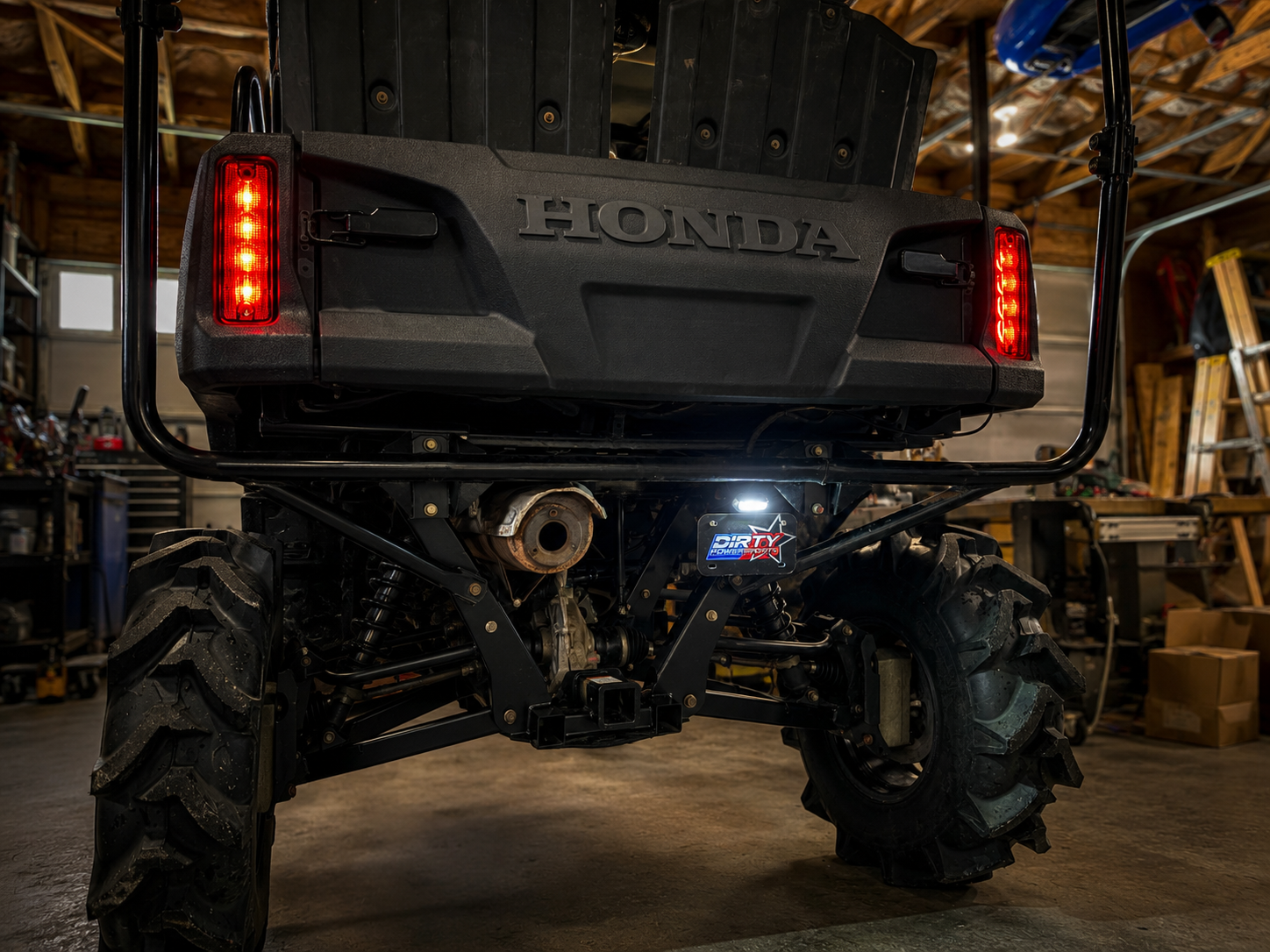 Honda ATV with visible branding in a workshop setting